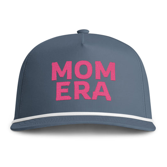 Image of an indigo hat with pink embroidery reading "Mom Era"