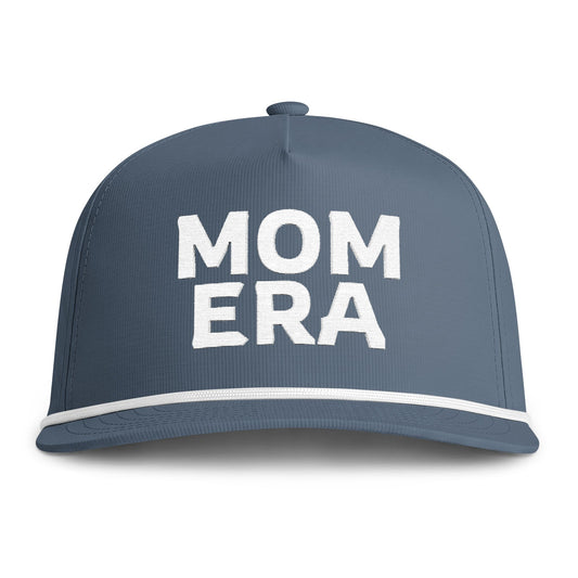 Image of an indigo hat with white embroidery reading "Mom Era"