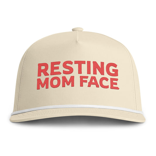 Image of an ivory hat with red embroidery reading "Resting Mom Face"