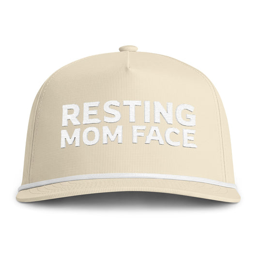 Image of an ivory hat with white embroidery reading "Resting Mom Face"