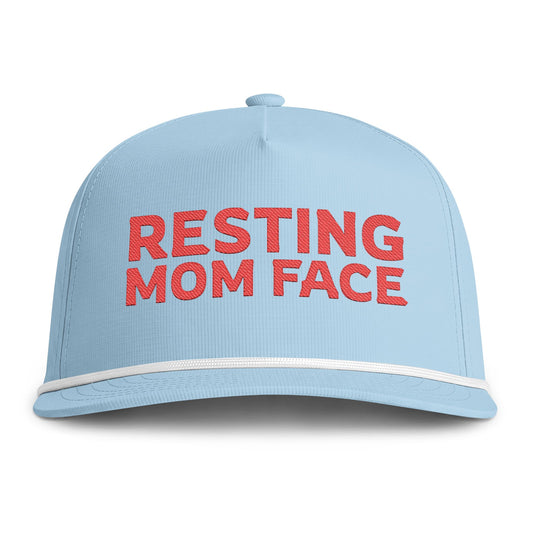Image of a light blue hat with red embroidery reading "Resting Mom Face"