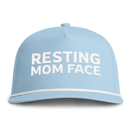 Image of a light blue hat with white embroidery reading "Resting Mom Face"